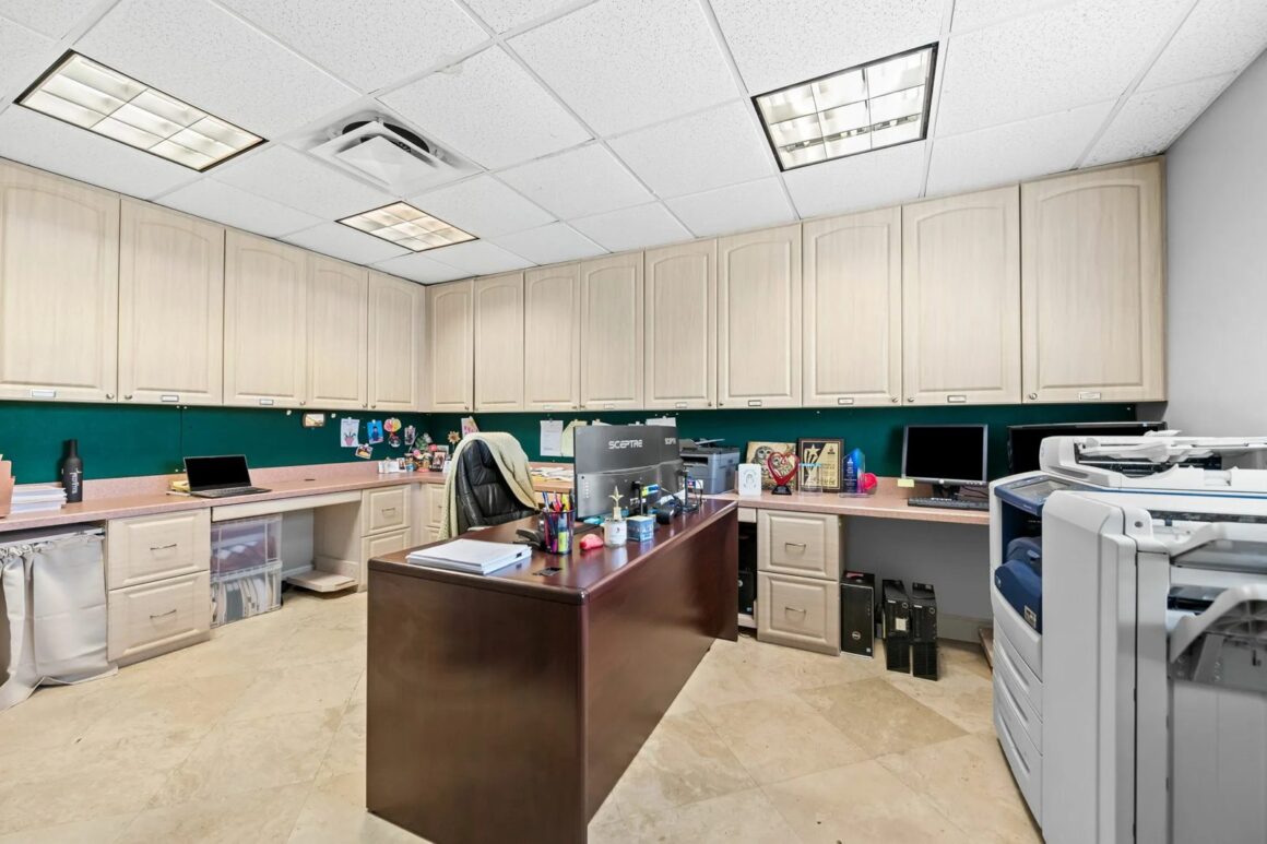 Open workstation area with built-in cabinetry at 2211 Davie Blvd